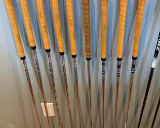 Nice selection of TaylorMade golf clubs, including Burner irons