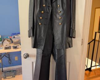 Very cool ca. 1970’s custom made navy blue leather three-piece set.  Approximate size is 4-6.  Comes with jacket, bell bottom pants & skirt