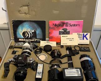 Ca. 1970’s Nikon F2 film camera system and Nikkormat FT N camera system set with lenses, extension rings, cable releases and flash components in custom aluminum carrying case