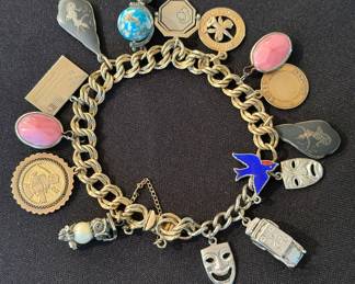 Vintage gold filled charm bracelet with mostly gold filled and base metal charms