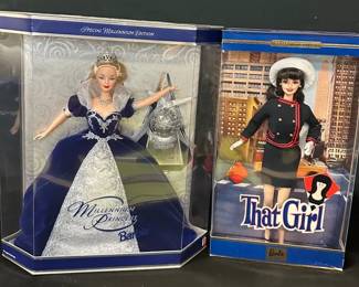Vintage Barbies – 2000 Millennium Princess & 2002 “That Girl” Collector Edition (Never Opened)
Set of two boxed vintage Barbies, both never opened and well-preserved.

• 2000 Millennium Princess Barbie – Special Millennium Edition. Features navy velvet & silver gown with tiara & ornament. Box has light surface scratches & small dings, overall excellent condition.
• 2002 “That Girl” Collector Edition Barbie – Based on the 1960s TV character. Box shows minor creasing; tie securing purse has aged & detached, though purse remains in place. Overall great condition.