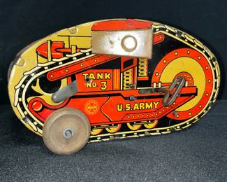 Vintage 1930s–1940s Marx Tin Litho Turnover Tank No. 3 Wind-Up Toy
Classic Louis Marx & Co. “Tank Corps No. 3” tin lithograph wind-up toy, marked U.S. Army along the sides.
• Original Marx logo visible on side panel
• Early lithographed tin design in red, yellow, & black with tank tread detailing
• Wind-up mechanism intact (untested for motion)
• Approx. 6" long (see ruler for scale)
• Moderate wear from age with minor scratches consistent with 1930s–40s tin toys
