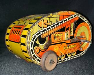 Vintage 1930s Louis Marx U.S. Army No. 3 Turnover Tin Tank
Step into prewar Americana with this Louis Marx & Co. “Tank Corps No. 3” wind-up turnover tank, produced in the early-to-mid 1930s. Designed to flip and keep rolling during play, this tin toy showcases Marx’s iconic lithography and durable construction.

• Marked with early MAR logo and “U.S. Army” lithograph
• Orange, yellow & black coloration with bold tank tread graphics
• Wind-up mechanism present (untested for function)
• Wooden wheels intact; expected age-related wear
• Measures approx. 7" long x 4" tall
