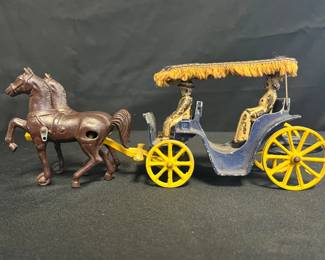 Vintage 1940s Stanley Toys Cast Iron Horse-Drawn Carriage
Beautifully detailed cast iron carriage and horses by Stanley Toys, dating to the 1940s. Features dual brown draft horses, a navy carriage with yellow spoked wheels, and seated passengers under a fringed canopy.
• Cast iron horses & carriage with original paint & fabric canopy
• Yellow wheels and harness connection in good shape for age
• Distinct Stanley Toys design — made in the U.S.A.
• Approx. 11" long (see ruler for scale)
• Visible paint wear & aging consistent with early cast iron pieces