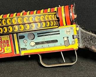 Vintage Late 1930s Marx G-Man Wind-Up Tin Toy Machine Gun
Step back into the golden age of imaginative play with this Marx G-Man tin lithograph wind-up toy gun, produced around 1939–1941. A classic example of pre-war design and mechanical ingenuity.
• Marked with early MAR (Louis Marx & Co.) logo
• Bright lithographed tin body in red, yellow & blue with original wooden stock
• Depicts young “G-Men” in classic 1930s comic style
• Wind-up mechanism present (untested for sound or motion)
• Approx. 22–24" long (see photos for scale)
• Expected age wear, scuffs, and surface patina consistent with its 80+ years