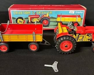 Vintage Schylling Wind-Up Tin Tractor & Trailer Toy with Box
Bright & cheerful Schylling wind-up tin tractor & trailer toy, complete with original key and box.
• Working wind-up mechanism with attached metal trailer
• Tin lithograph in classic red & yellow farm design
• Includes original Schylling box (shows light creasing and storage wear)
• Trailer chain missing one small link as pictured
• Measures approximately 12" long overall
