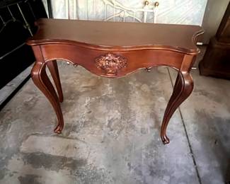 $75. French Provincial Sofa Table. Elegant curves, ornate carving, and signature Cabriole Legs