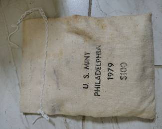 Large bag of uncirculated 79p dollars.