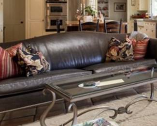 Ethan Allen black leather camelback sofa.