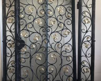 Wrought iron door with sidelights. The door with sidelites is 84.5H x 72.5W overall. Door alone is 82H x 46.75W. Incredible workmanship, unique. $4500.