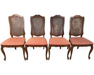 A Set of Four Louis XV Style French Provincial Carved Wood and Cane Side Chairs