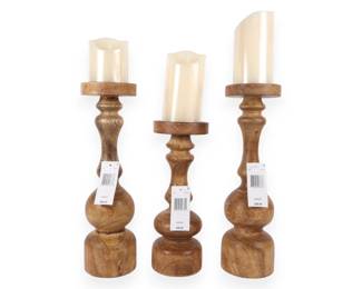 A Set of Three Harvest Natural Mango Wood Turned Pillar Candle Holders with LED Candles
