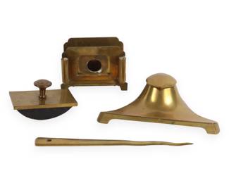 A Four-Piece Art Deco Style Brass Desk Set
