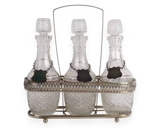 A Vintage Three-Bottle Glass Decanter Set in Silver-Toned Caddy