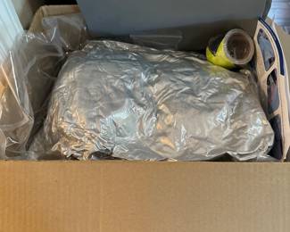 car cover new in box (we believe for a Camry)