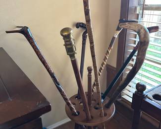 large collection of canes and walking sticks 