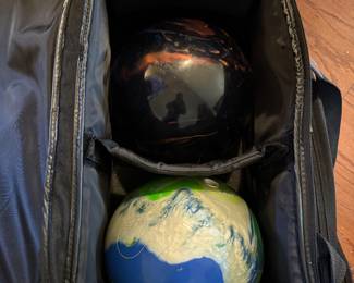 #28	Brunswick rolling bowling case with 2 balls	 $80.00