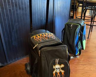 #28	Brunswick rolling bowling case with 2 balls	 $80.00