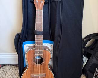 *	#74	Ukulele with case Aloha	 $50.00
