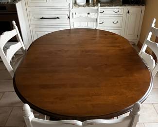 FINE DINING TABLE WITH TWO ARM AND TWO SIDE CHAIRS WITH ONE LEAF. FROM CAPACCHIO BROTHERS