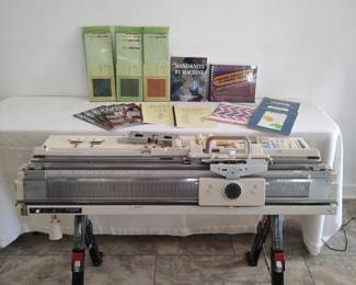 Singer SK700 knitting machine with Singer SRP60 ribber, folding stand, punchcards, machine knitting books, tools, accessories