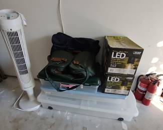 patio lights, storage bins, duffle bags, fan, fire extinguishers
