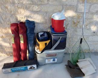 folding camp chairs, tent, coolers, fishing nets, waders, water jugs