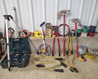 Bosch laser level, rolls of new wire, conduit benders, fluke meters, lifting straps, bolt cutters, measuring tapes, extension cords