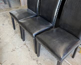 3 black vinyl chairs