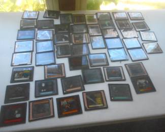 selection of glass slides advertising old movies mostly. There are others as well