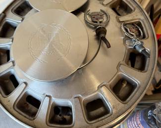 Cadillac hubcaps and Hood ornaments