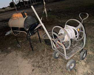 Charcoal grill and hose reel