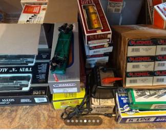 Collected over many years! Lots of track, buildings and accessories! A New York Central still in the box. Passenger cars, six light up passenger cars.