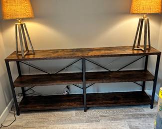industrial-style bookshelf with black metal frame and pine natural wood shelves. measures 79” tall by 69” wide by 16” deep. pd $400.