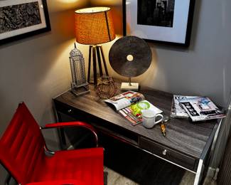 weathered wood desk and chair. Everything in this picture is for sale the desk has two drawers and chrome accent measures 49 inches wide bye 30 inches tall by 23 1/2 inches deep . The red chair is perfect as well