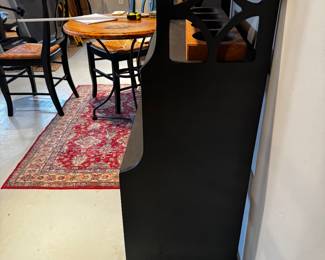 bookshelf side view... decorative carved wood with four shelves measures 26 inches wide by 43 inches tall by 15 inches deep.