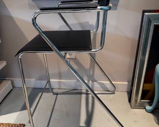 black barstool with black leather and chrome accents 22" wide, 39" tall, 17" deep