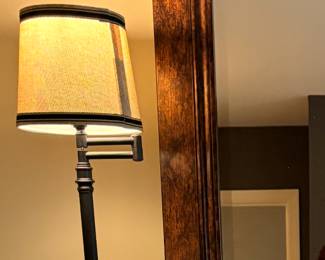 Swing arm lamp by Kira Home Fremont ...30" adjustable table lamp with a matte black finish and a light gray linen shade.