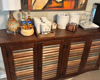 four door fluted server, entertainment center, credenza, multicolor door panels from Woodstock furniture, 60” x 34“ tall by 14” inches deep. paid $500.