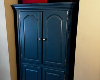 Armoire, chalk-painted solid wood
teal blue mallard, armoire/entertainment center/storage, two upper large cabinet doors and two lower cabinet doors, interior contains two shelves 37 inches wide by 71 inches tall 24 inches deep.