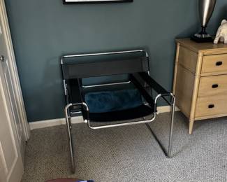 Wassily designer chair black leather straps and chrome accents. measures 30 inches wide by 27 inches tall by 27 inches deep. Paid $1200