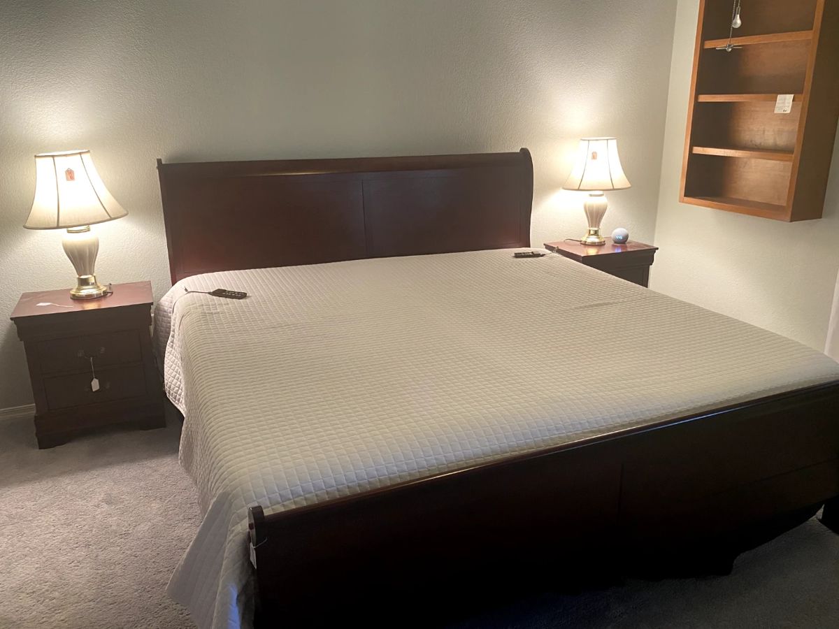 King-size cherry finish bed frame and nightstands.
