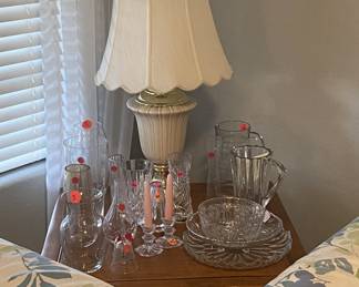 Square end table with storage has matching hexagon table. 
Also shown: lamp,  various crystal items.