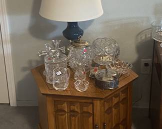Vintage hexagon end table with storage. Has matching square table. 
Also shown: Waterford and Lenox crystal,  antique biscuit jar,  vintage dishes