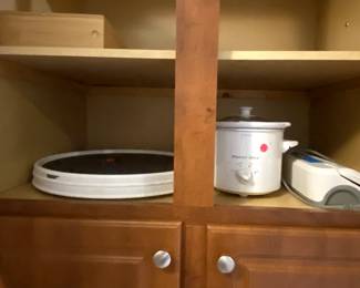 Crock pot, vacuum sealer, 2 lazy Susan turntables.