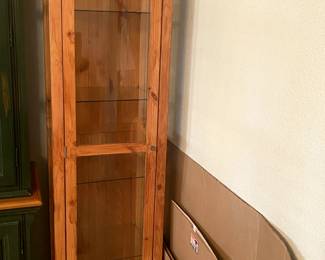 Narrow curio cabinet
