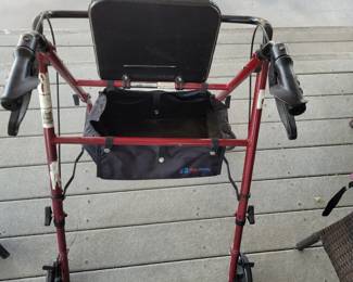 Walker with seat/storage. Adjustable height.  2 available.