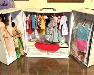 vintage barbie dolls and clothes in case
