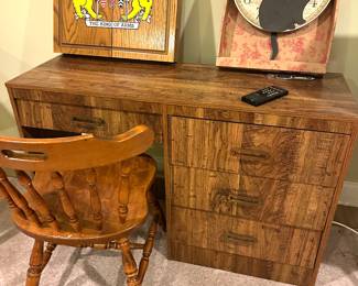 dart board, desk, chair