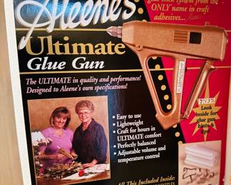 Glue guns of all shapes and sizes some new in boxes plus lots of glue sticks